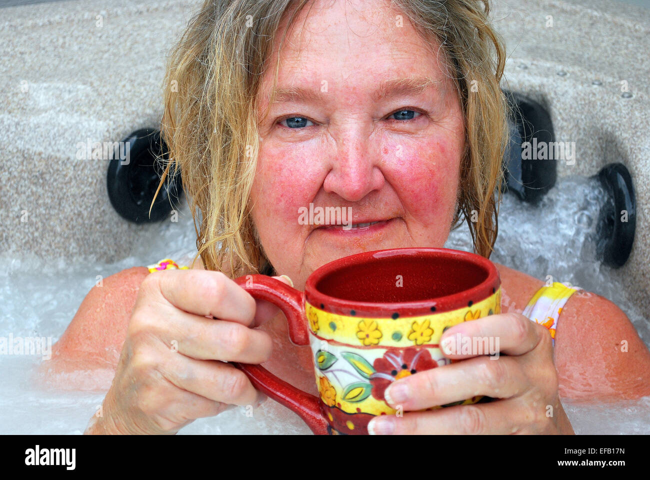 Female relaxing in her hot tub Stock Photo Alamy