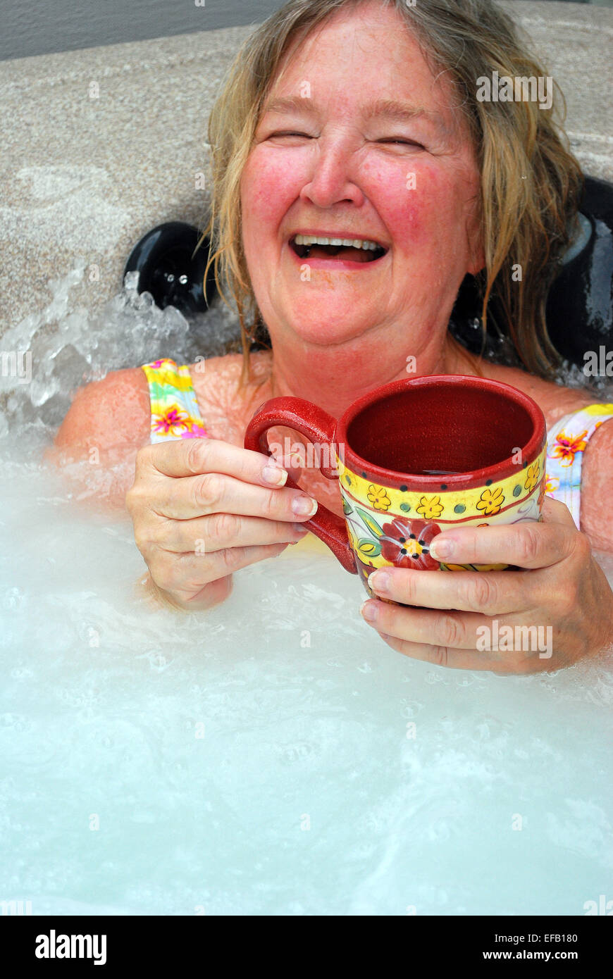 Female relaxing in her hot tub Stock Photo Alamy