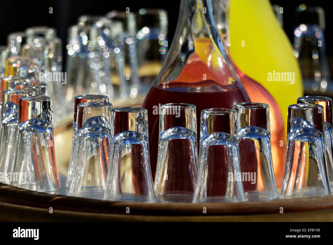 Glasses in front of glass carafes with juices, Istanbul, Turkey Stock Photo