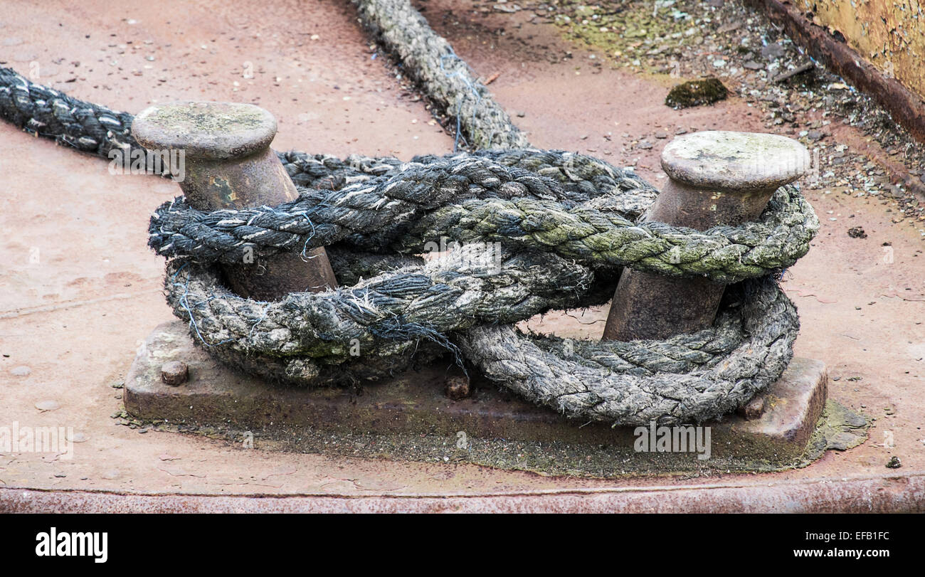 old mooring rope tied to a boat Stock Photo