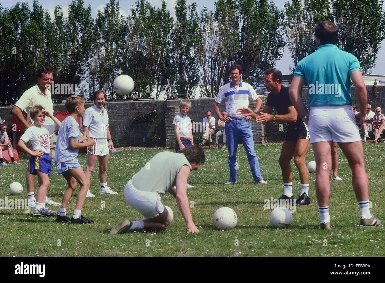 Former Leeds United and England footballer Paul Reaney coaching football at a Pontins holiday camp. England. UK. Circa 1980s Stock Photo