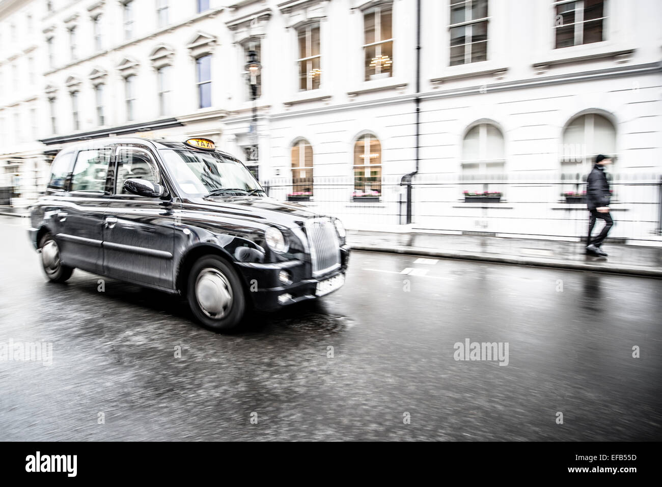 Black taxi cab on London streets Stock Photo
