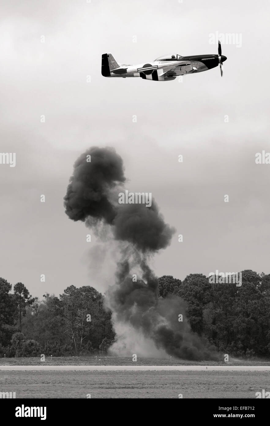 Wolrd War II era airplane dropping bombs Stock Photo