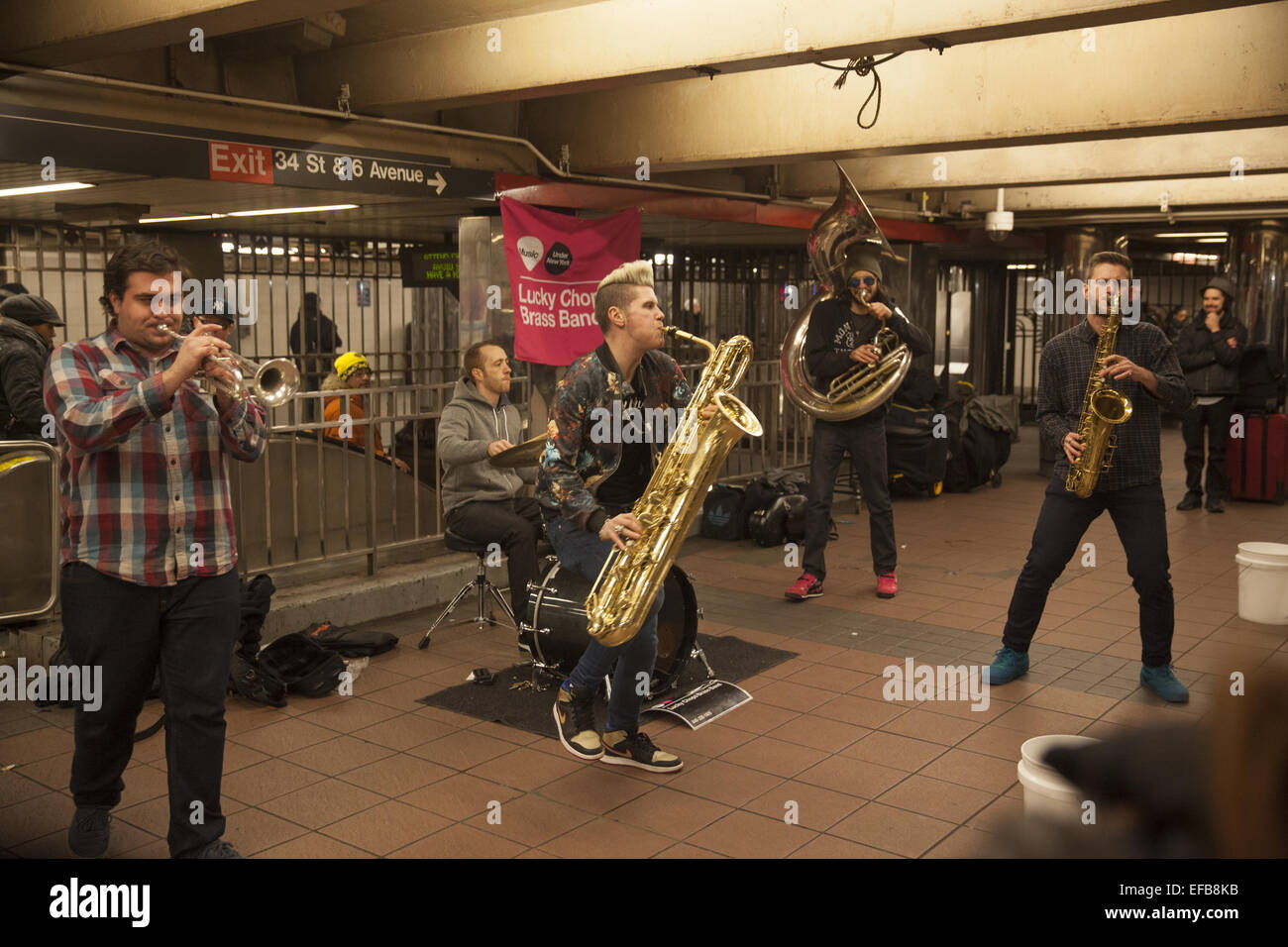 Underground Music: Lucky Chops Brass Band performs at the 34th Street subway station in Manhattan under Manhattan Mall. Stock Photo