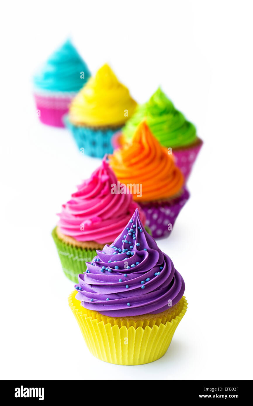 Row of colorful cupcakes against white Stock Photo