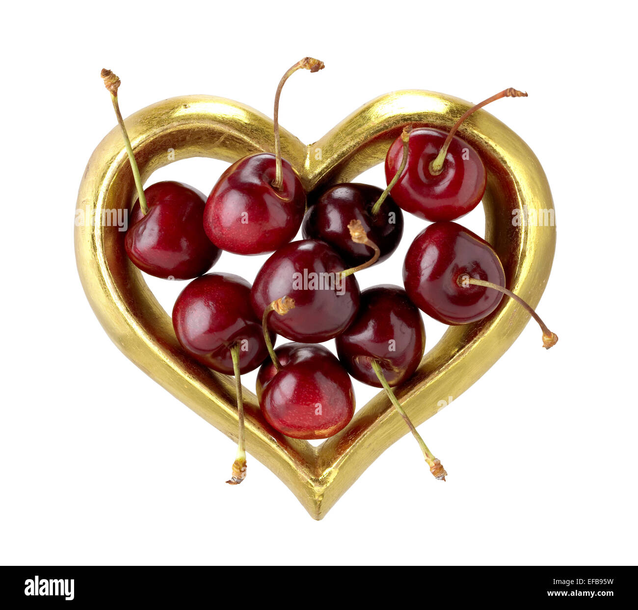 cherries in gold heart Stock Photo Alamy