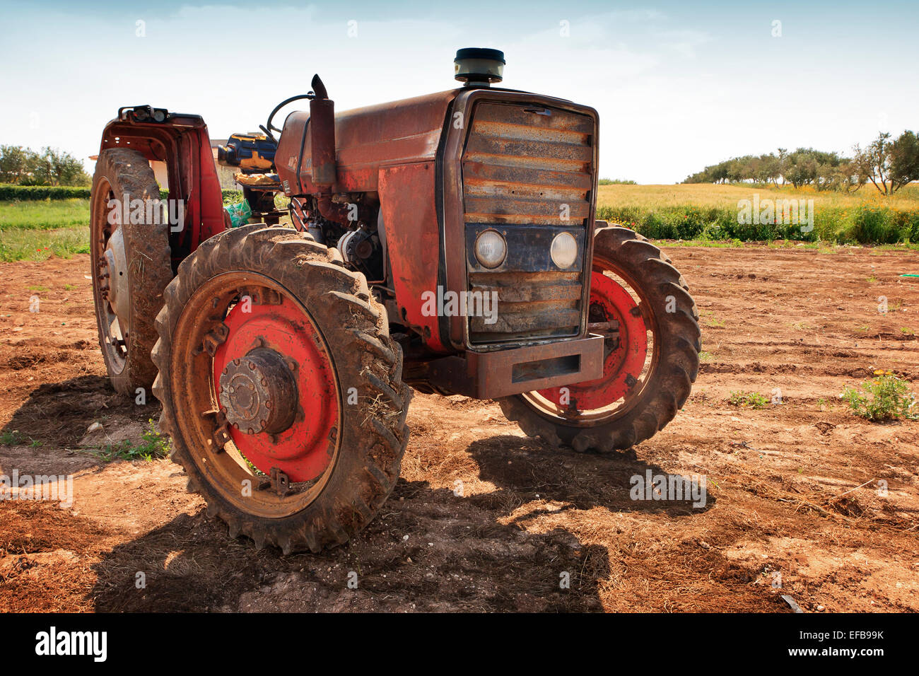 Old rusty tractor in the italian countryside, Marzamemi, Pachino, Sicily Stock Photo