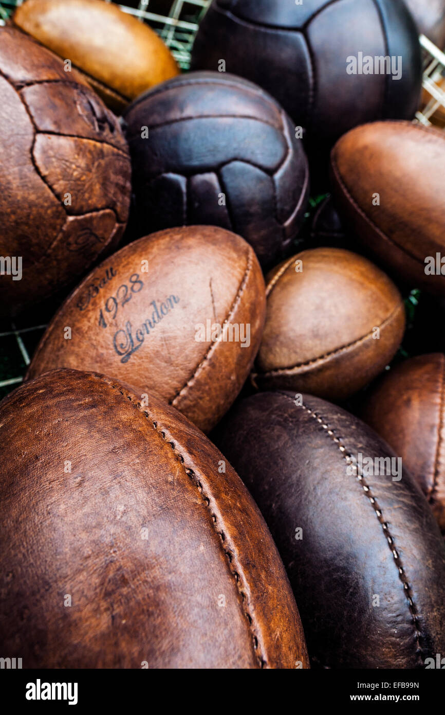 Old fashion leather football and rugby balls Stock Photo