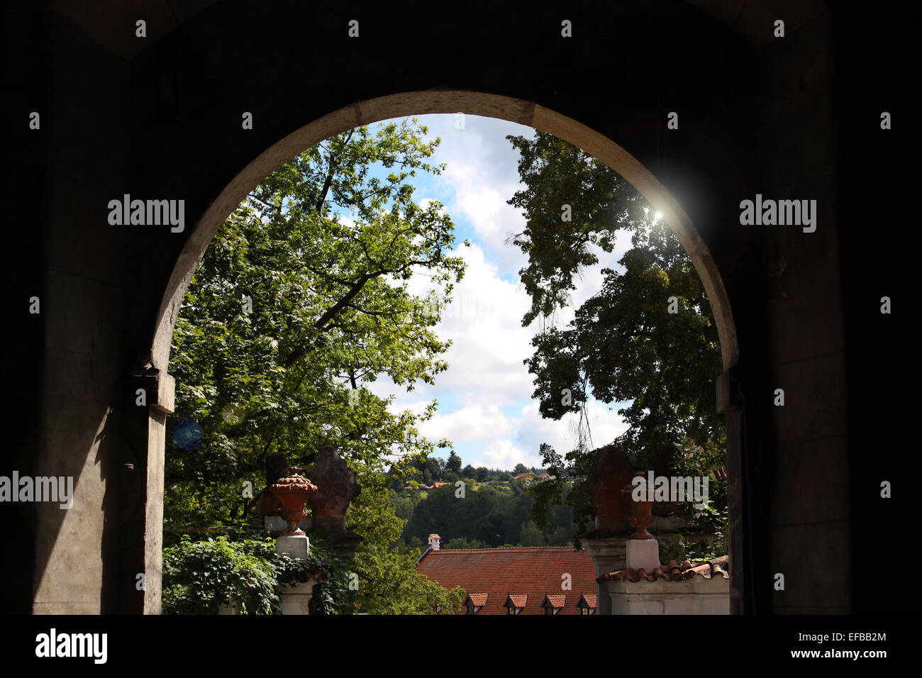 A view through an old arch with flare. Stock Photo