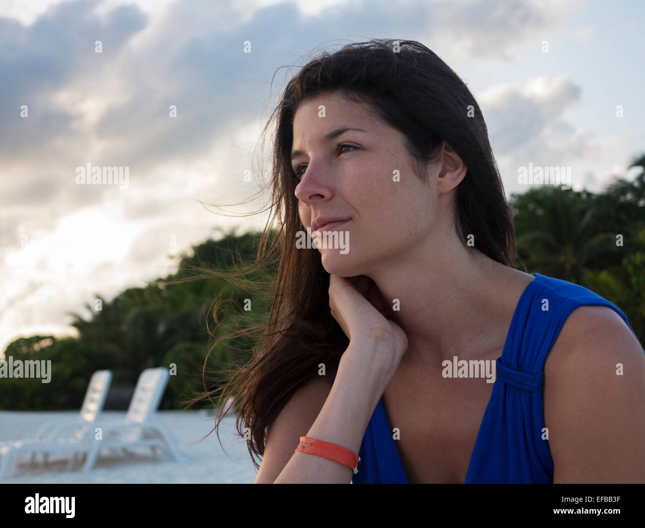 Female sitting on beach alone hi-res stock photography and images - Alamy