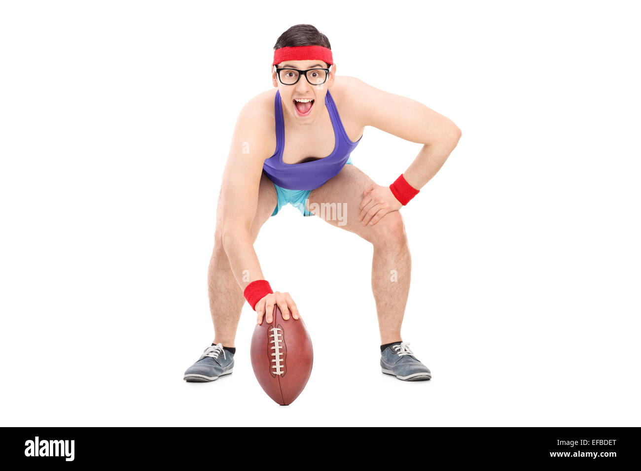 Young sportsman posing with a football isolated on white background Stock Photo