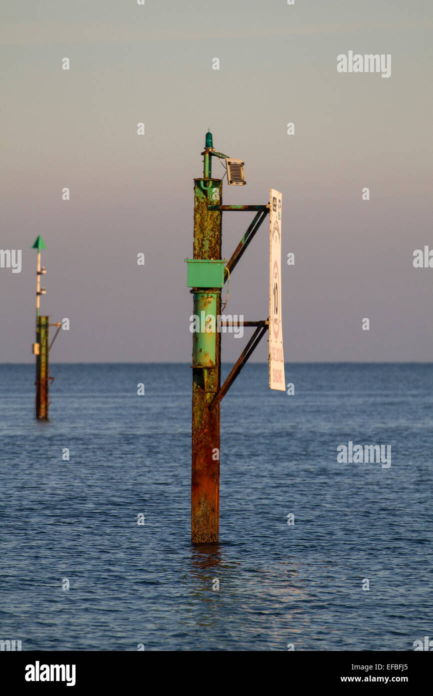 rusty channel marker in sea with calm water and sky Stock Photo Alamy