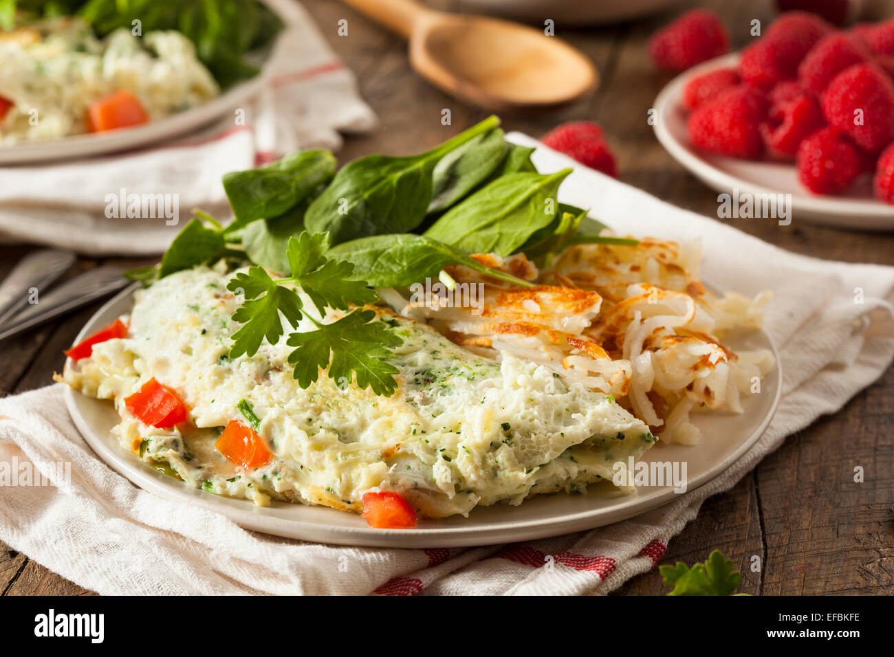 Healthy Spinach Egg White Omelette with Tomatos Stock Photo