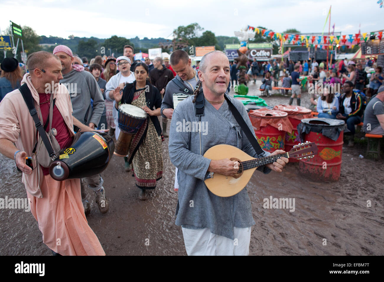 28th June 2014. Hare Krishnas wander through the festival on Saturday afternoon. Stock Photo