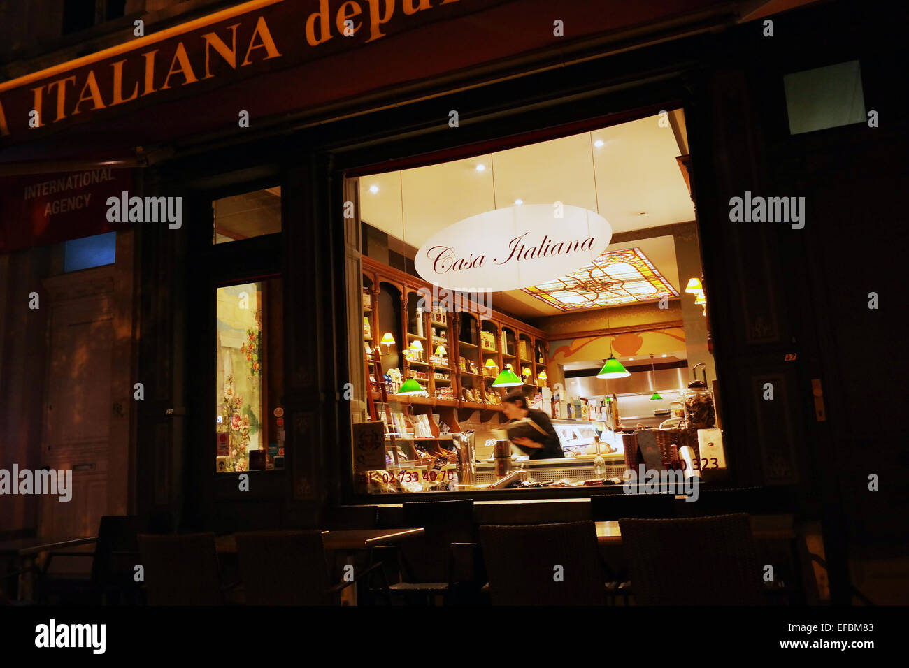 BRUSSELS, BELGIUM - OCTOBER 2014: Shop window of an Italian delicatessen store by night in the EU offices district in Brussels Stock Photo