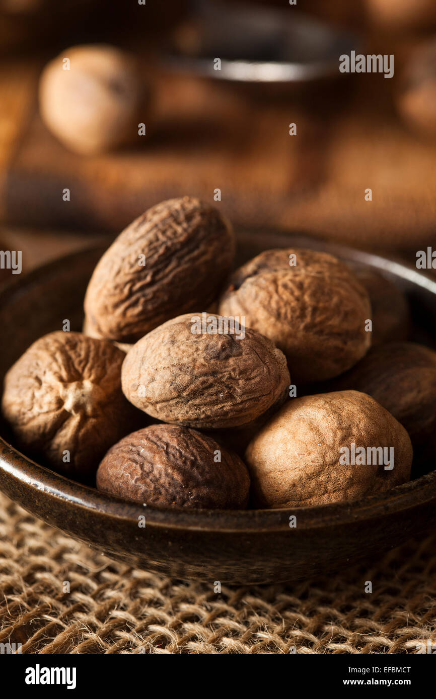 Raw Organic Dry Nutmeg to Use as a Spice Stock Photo - Alamy
