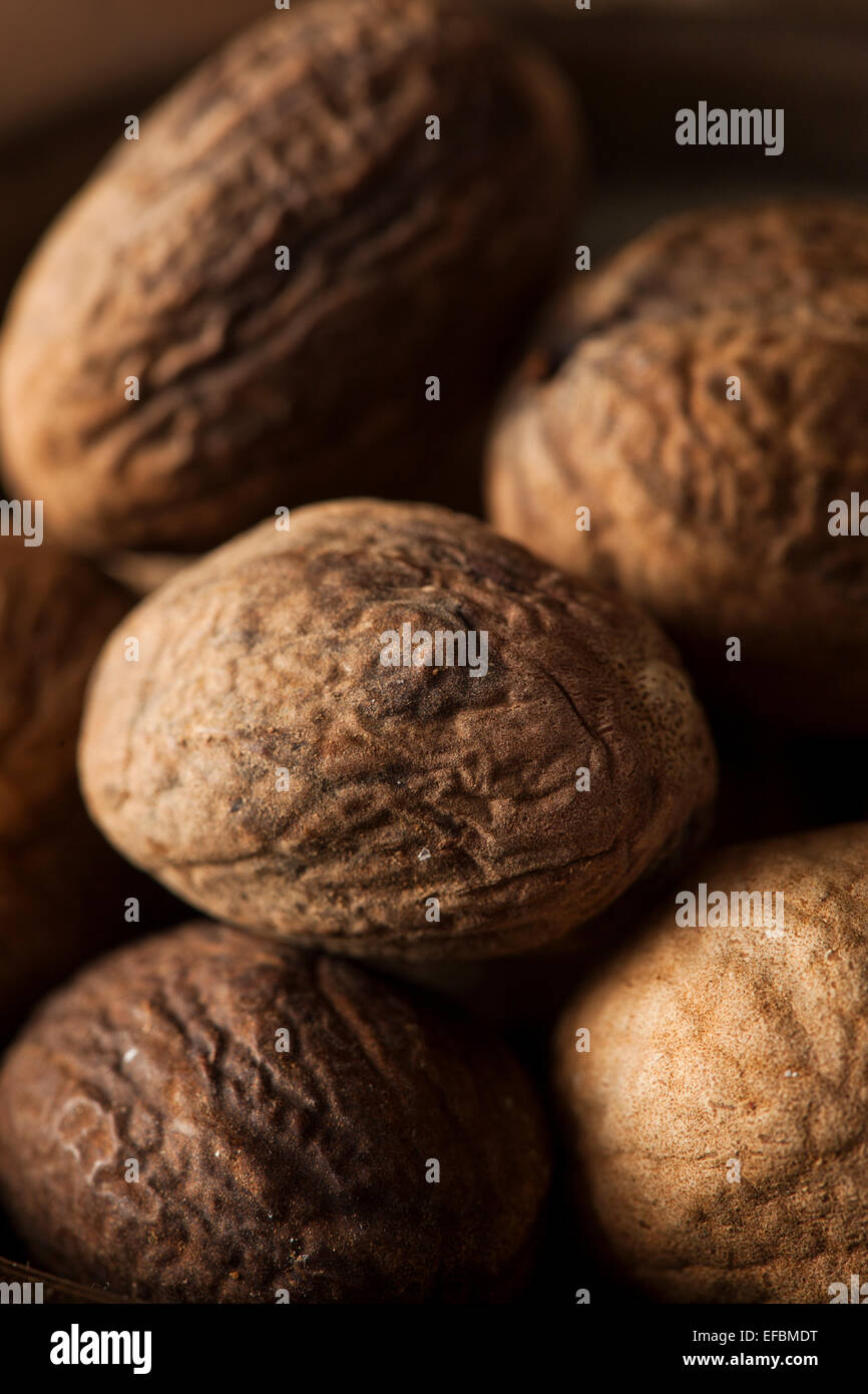 Raw Organic Dry Nutmeg to Use as a Spice Stock Photo - Alamy