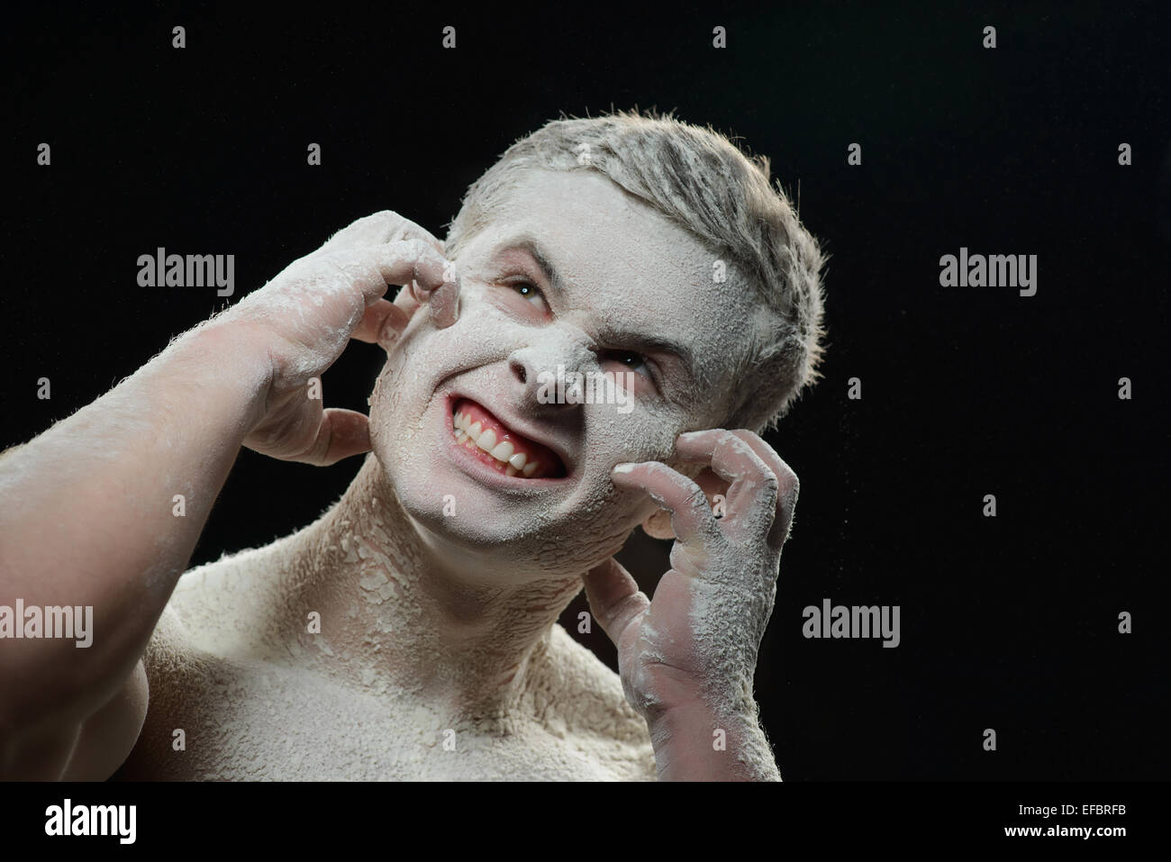 Handsome man covered with powder itching Stock Photo