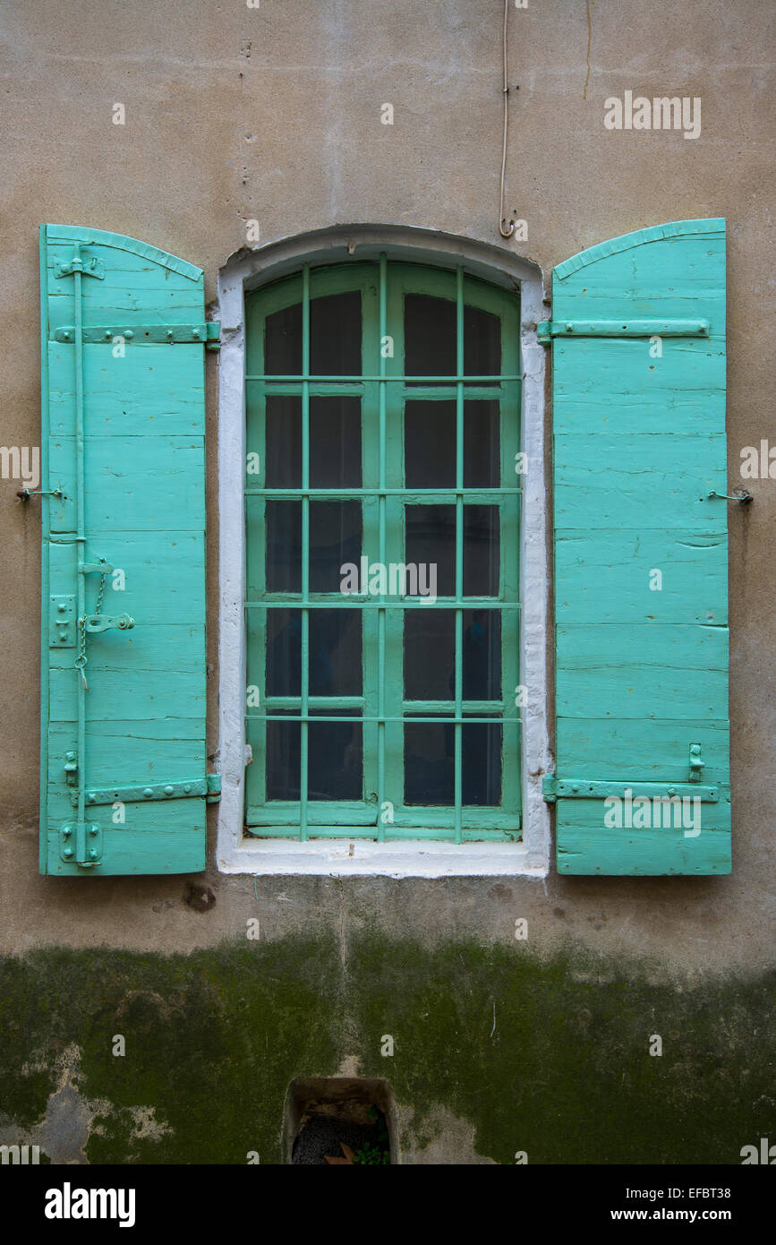 Green window shutter, Arles, France Stock Photo
