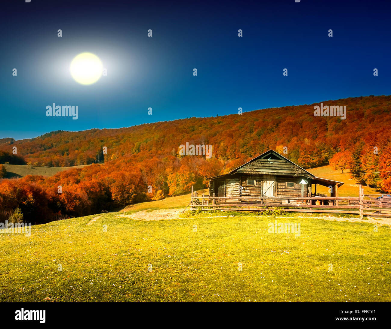 Sunset landscape with old rural house Stock Photo - Alamy