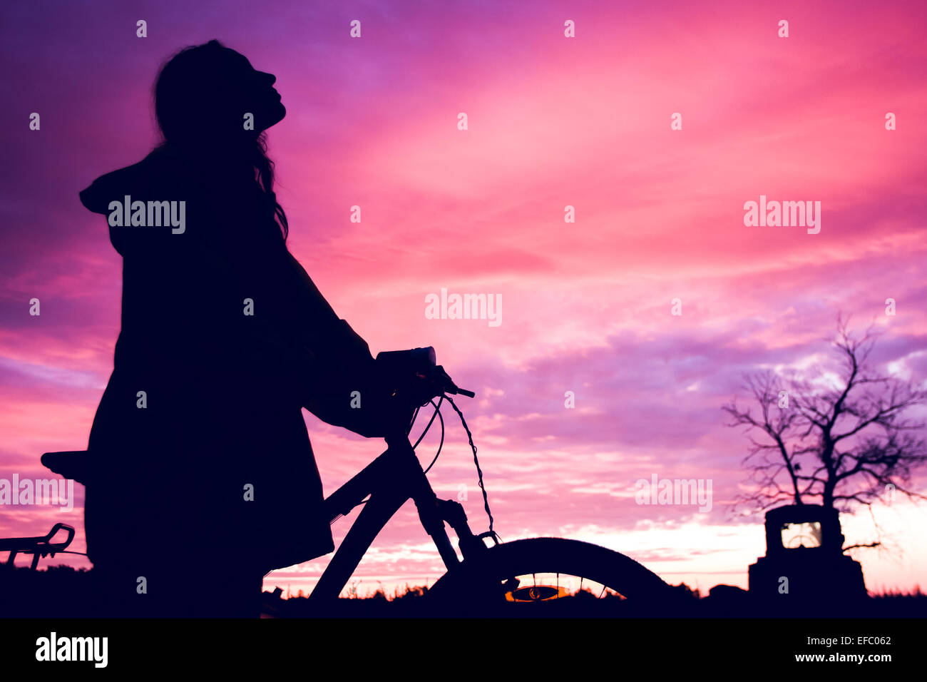 Girl at sunset Stock Photo - Alamy