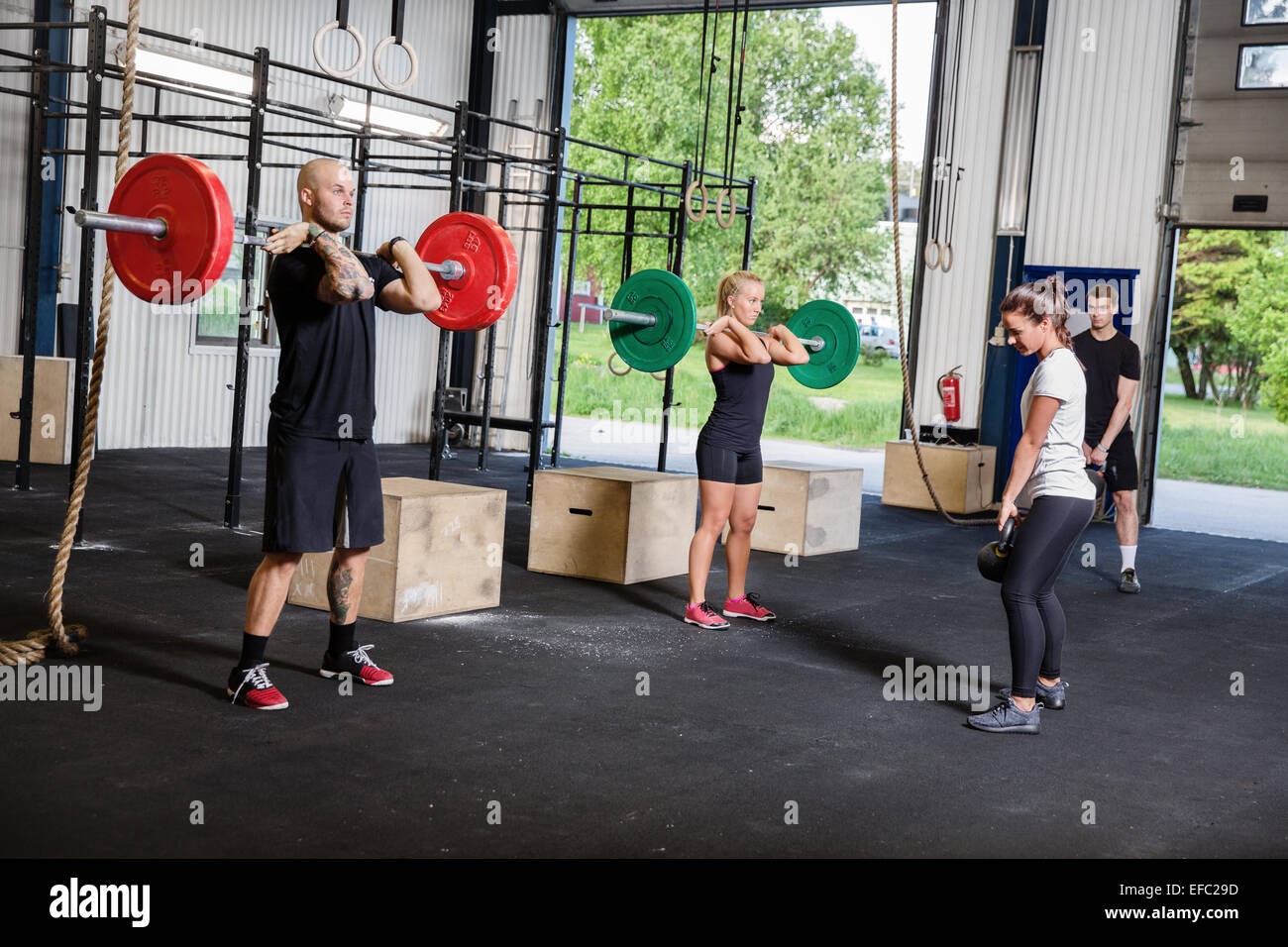 Crossfit training with weights and kettlebells Stock Photo