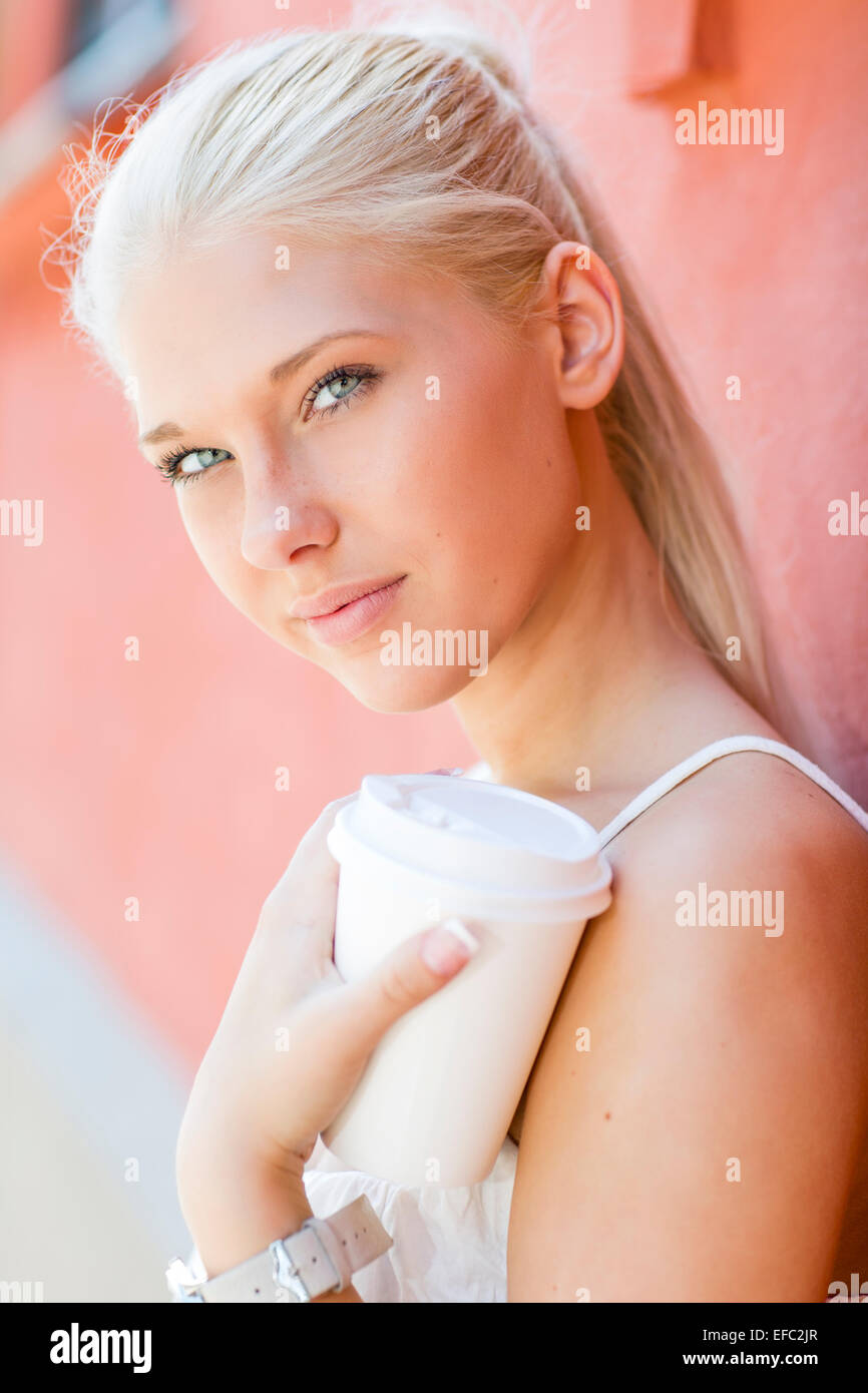 Natural and pretty teenage girl drinking coffee Stock Photo