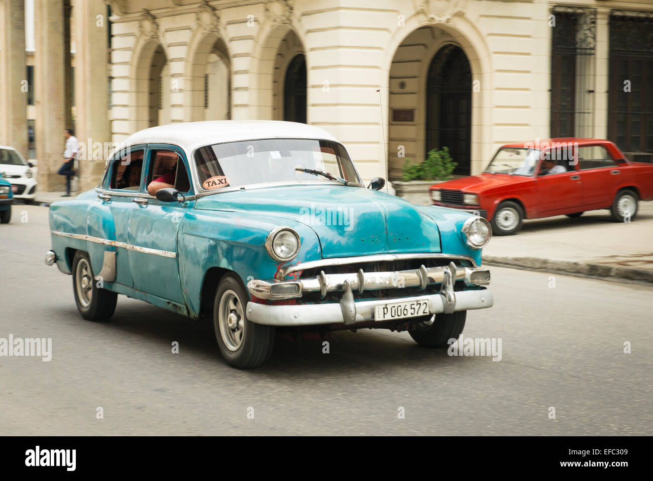 Cuba Old Havana La Habana Vieja Calle Zulueta moving old classic vintage 1950's American car taxi cab blue Chevy Chevrolet Stock Photo