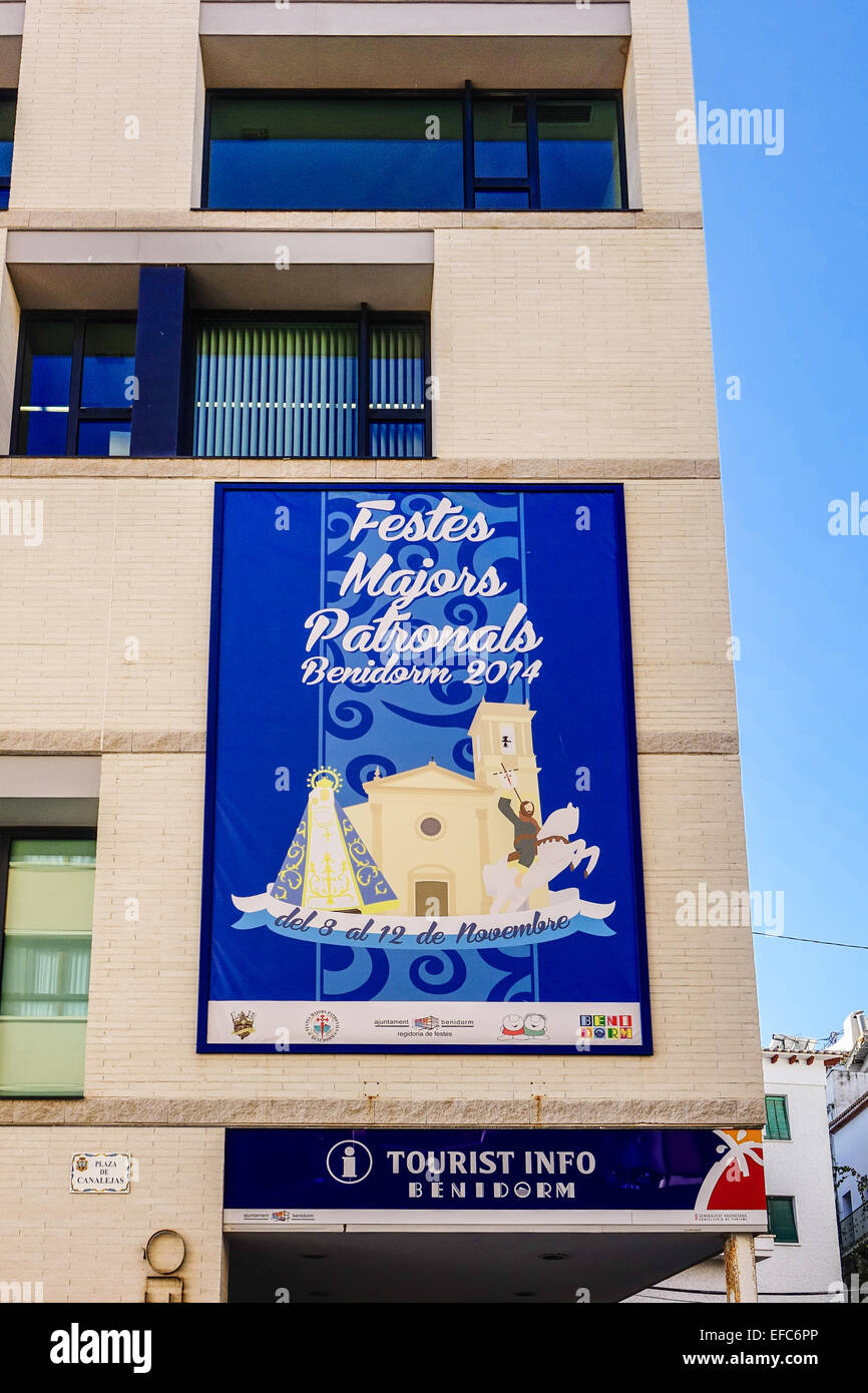Benidorm Tourist Office with poster for Fiesta Majors Patrionals 2014 on wall, Costa Blanca, Spain Stock Photo
