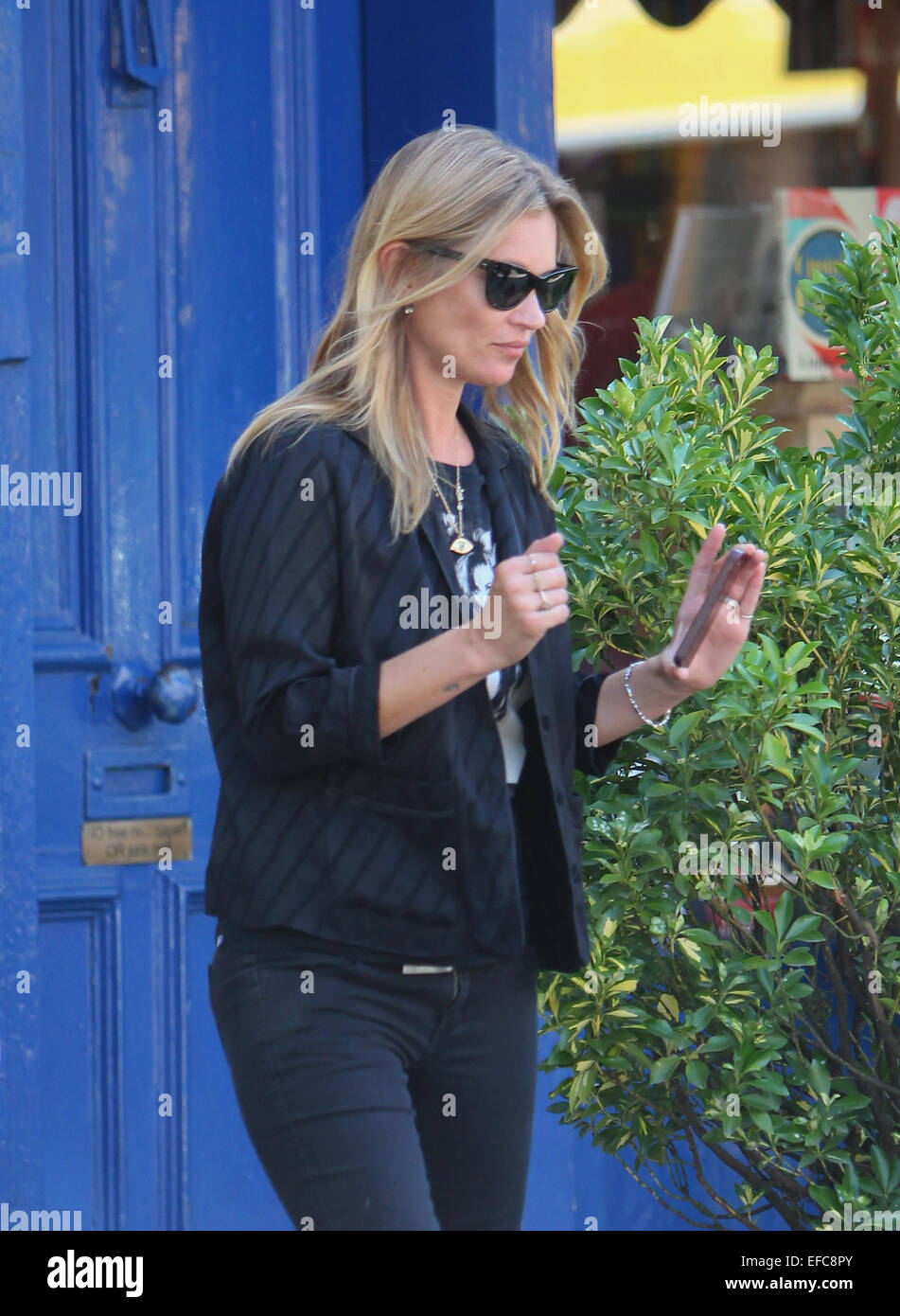Kate Moss, wearing an Amy Winehouse T-shirt, out in Primrose Hill with ...