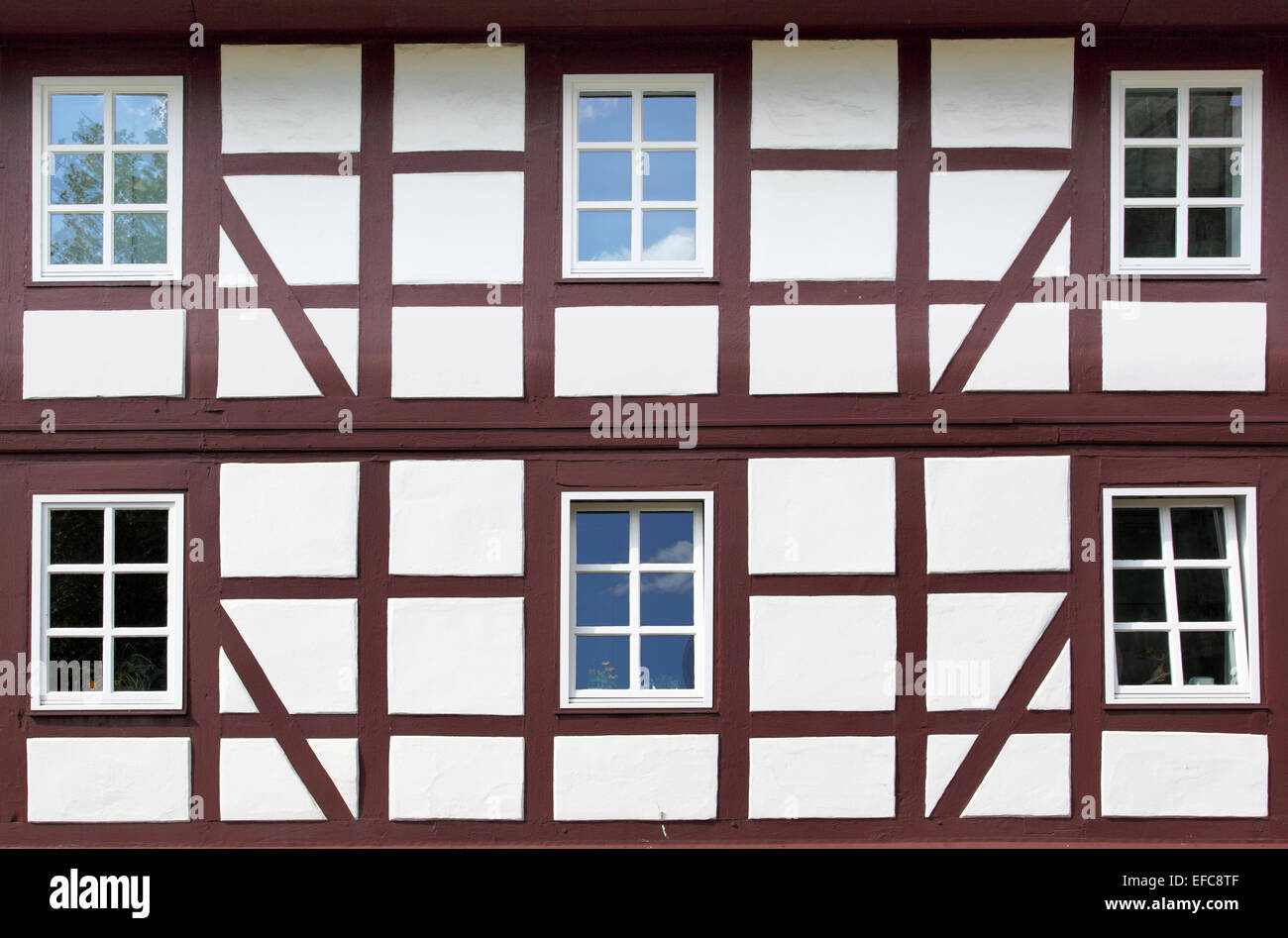 Windows of old timber framing house Stock Photo