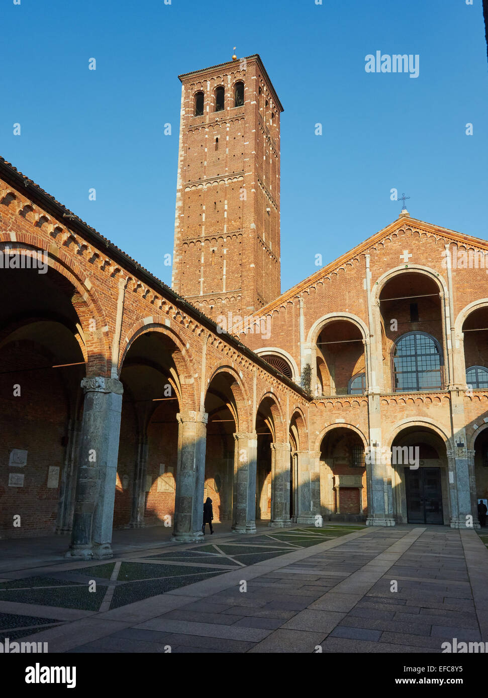 Porticoed atrium courtyard and bell tower of Romanesque Sant' Ambrogio Basilica Milan Lombardy Italy Europe Stock Photo