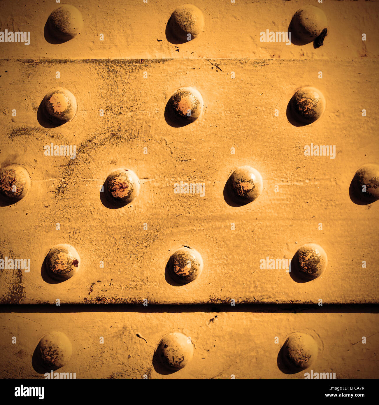 Metal surface with rivets, may be used as background Stock Photo