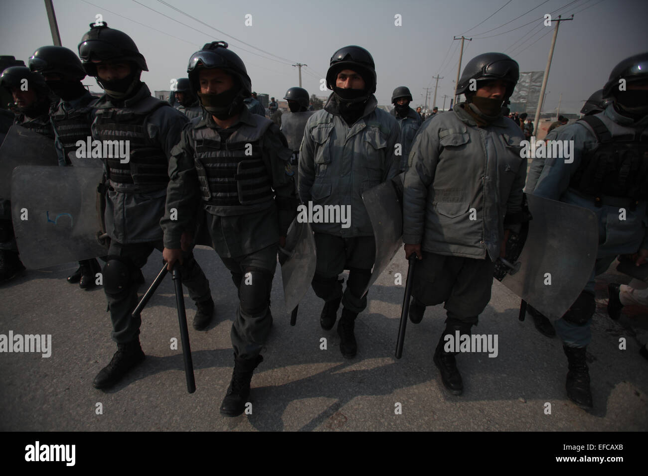 Kabul, Afghanistan. 31st Jan, 2015. Afghan policemen arrive during an angry protest against caricatures published in French magazine Charlie Hebdo in Kabul, Afghanistan on Jan. 31, 2015. At least five people were wounded as a demonstration to protest publishing Muslims' prophet caricature by French Charlie Hebdo magazine turned violent in eastern Kabul. © Ahmad Massoud/Xinhua/Alamy Live News Stock Photo