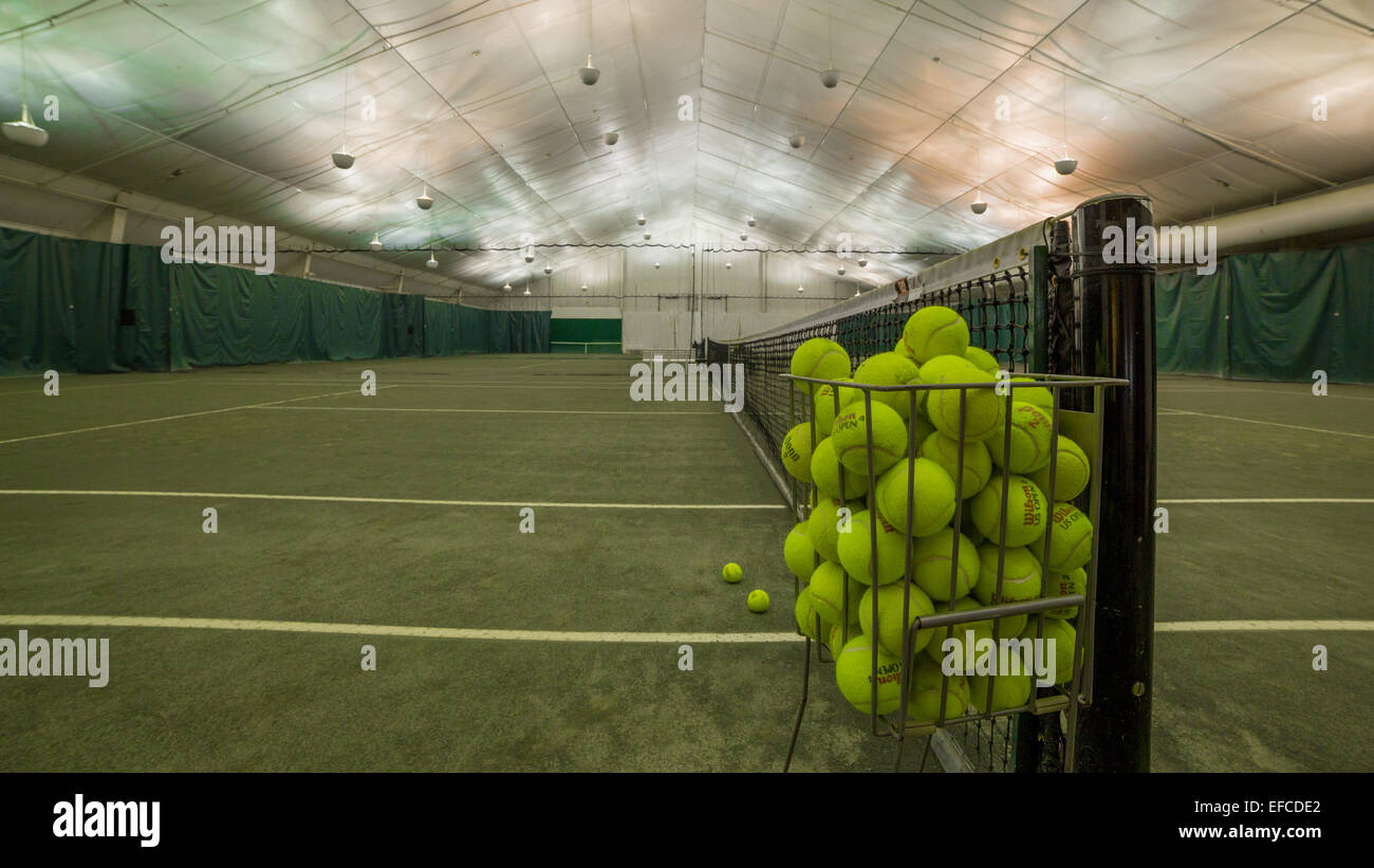 Indoor tennis court and tennis balls Stock Photo Alamy