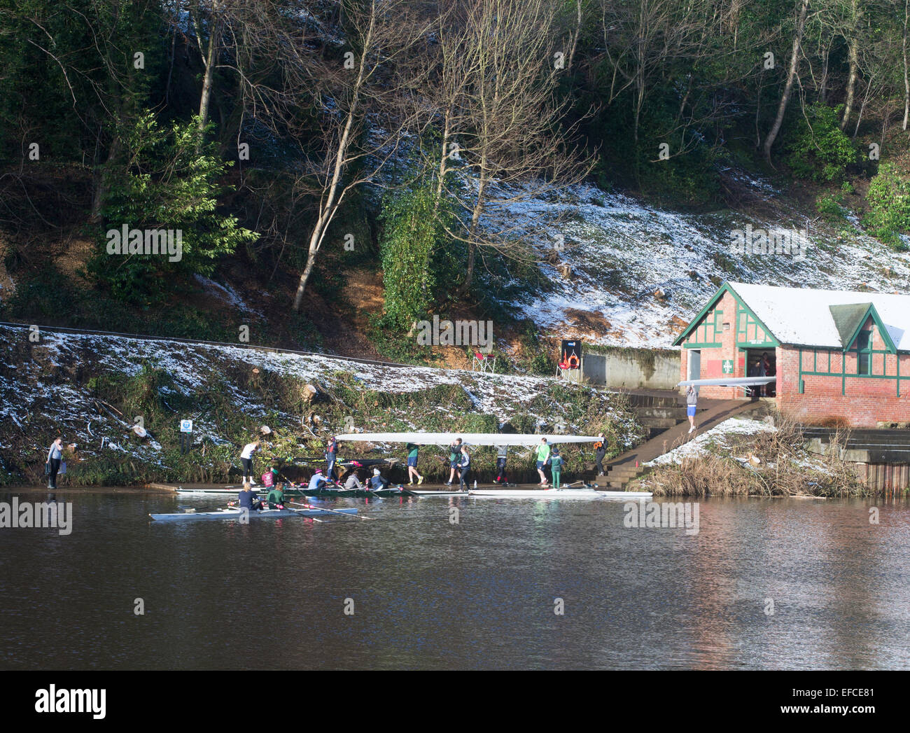 Students launching boats from Durham School Boat Club boathouse, Durham City north east England, UK Stock Photo