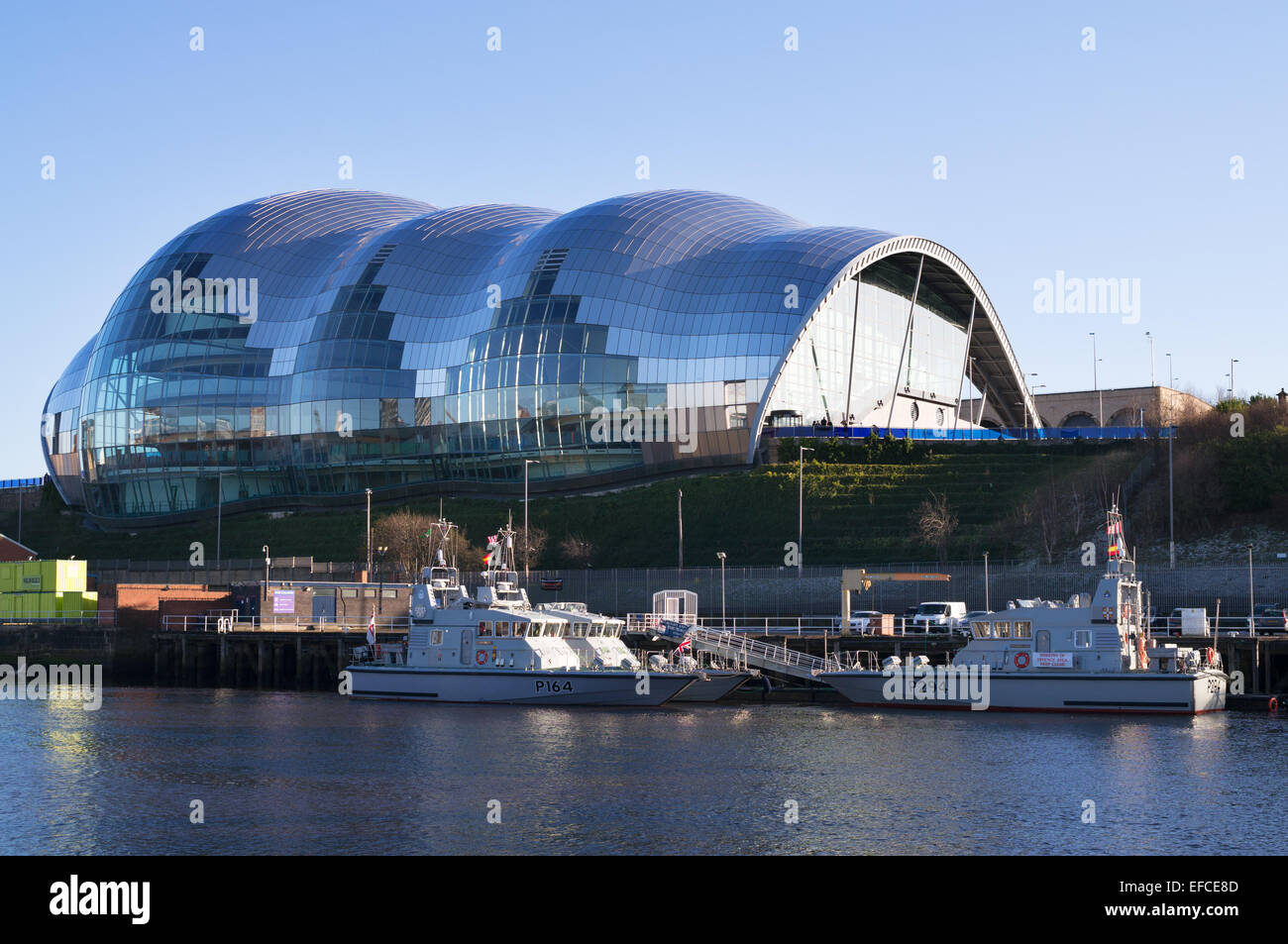 Patrol boats moored in front of the Sage concert hall in Gateshead, north east England, UK Stock Photo