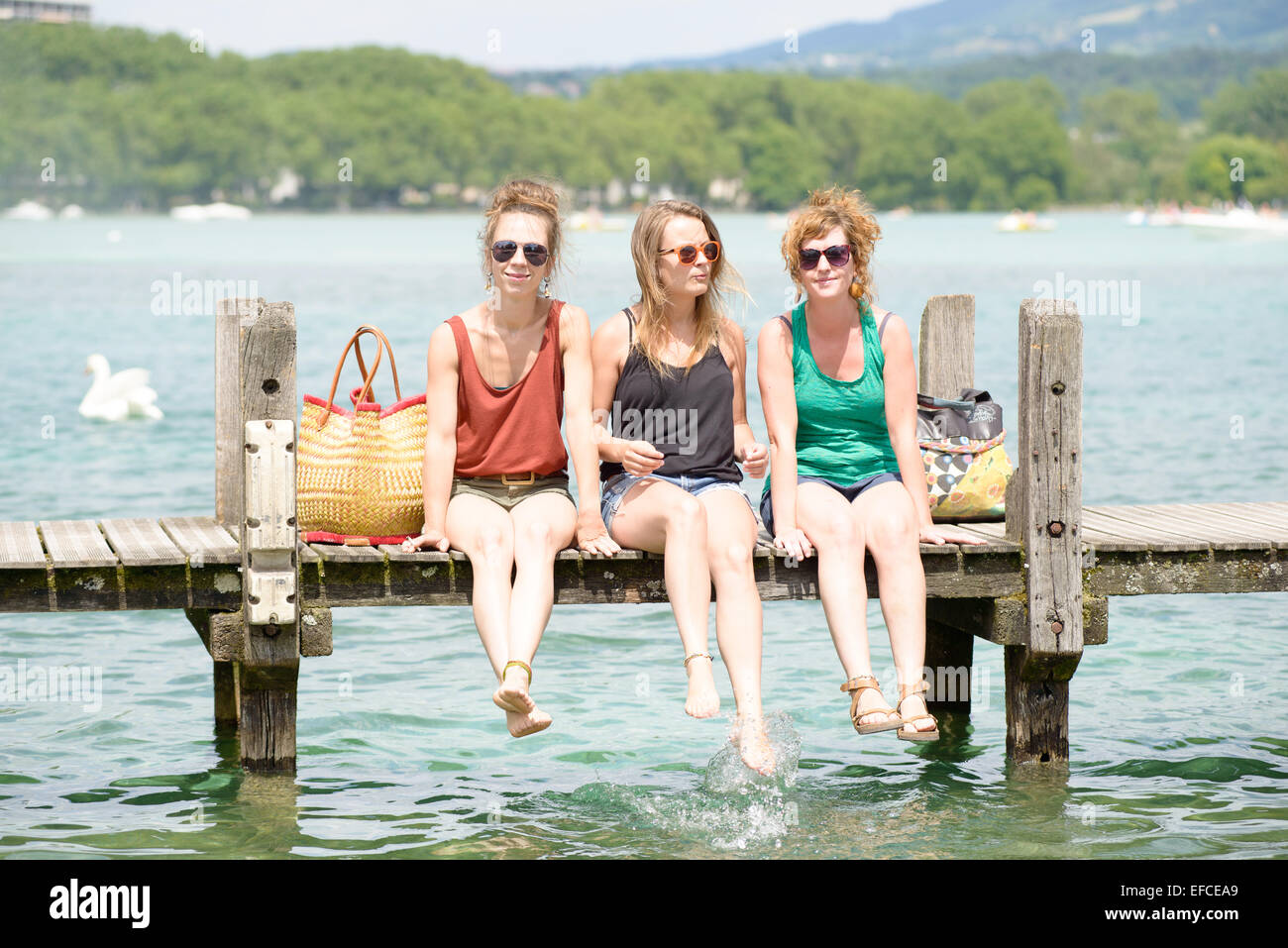 three young women make tourism in Annecy Stock Photo - Alamy
