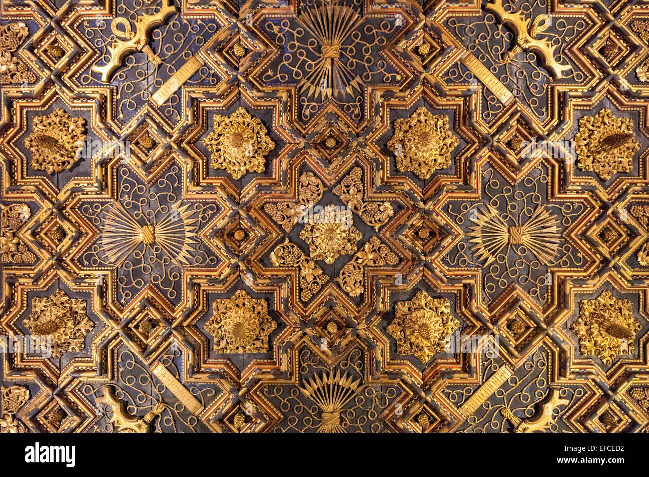 Elaborate abstract geometric Islamic pattern decorating the ceiling of the Aljaferia Place in Zaragoza Spain. Stock Photo