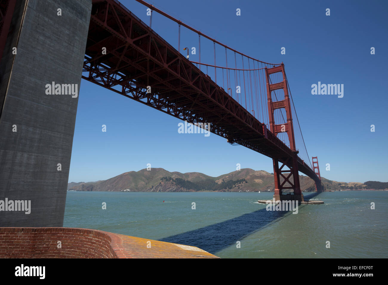 Golden Gate Bridge looking north toward Marin County, viewed from Fort Point National Historic Site, San Francisco, California, United States Stock Photo