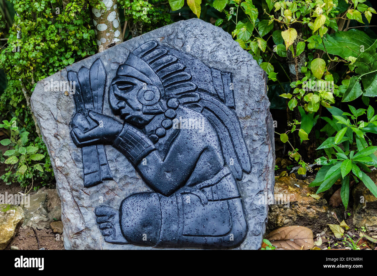 A stone carved Maya Indian figure. Belize, Central America. Stock Photo