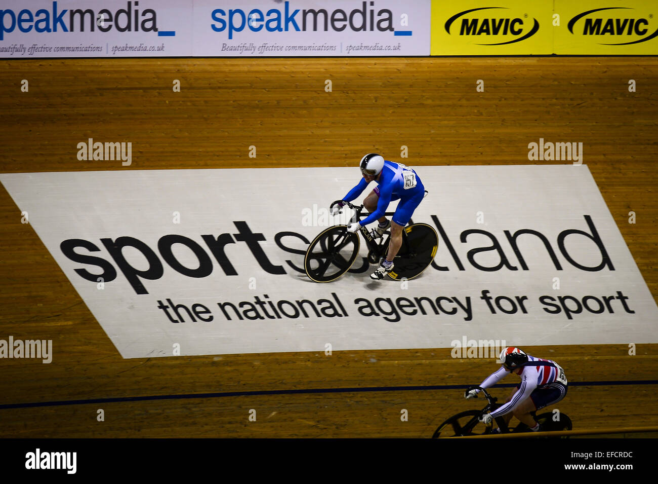 31.01.2015  Glasgow, Scotland. Scottish rider Jonathan Mitchell crosses the Sports Scotland banner in action during Round 4 of The Revolution Series at the Sir Chris Hoy Velodrome. Stock Photo