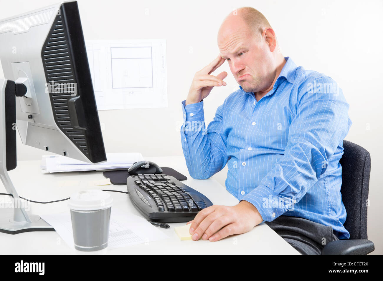 Tired and sad office worker Stock Photo