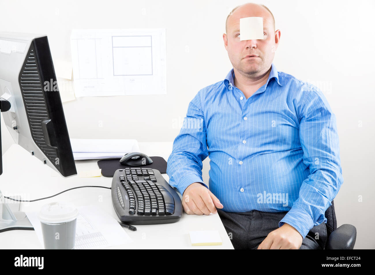 Office worker with note in the face Stock Photo