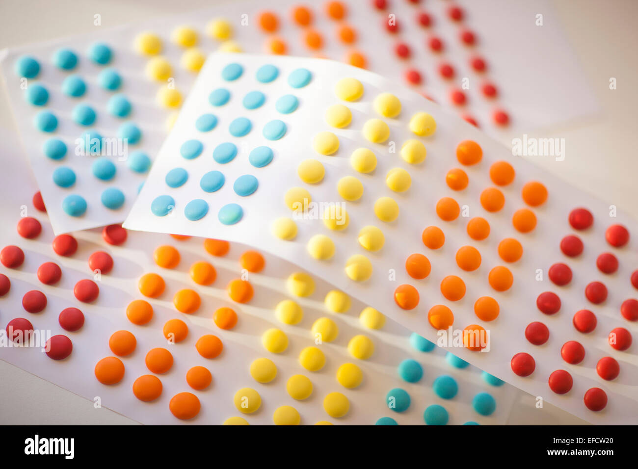 dot candies on strip of paper Stock Photo Alamy