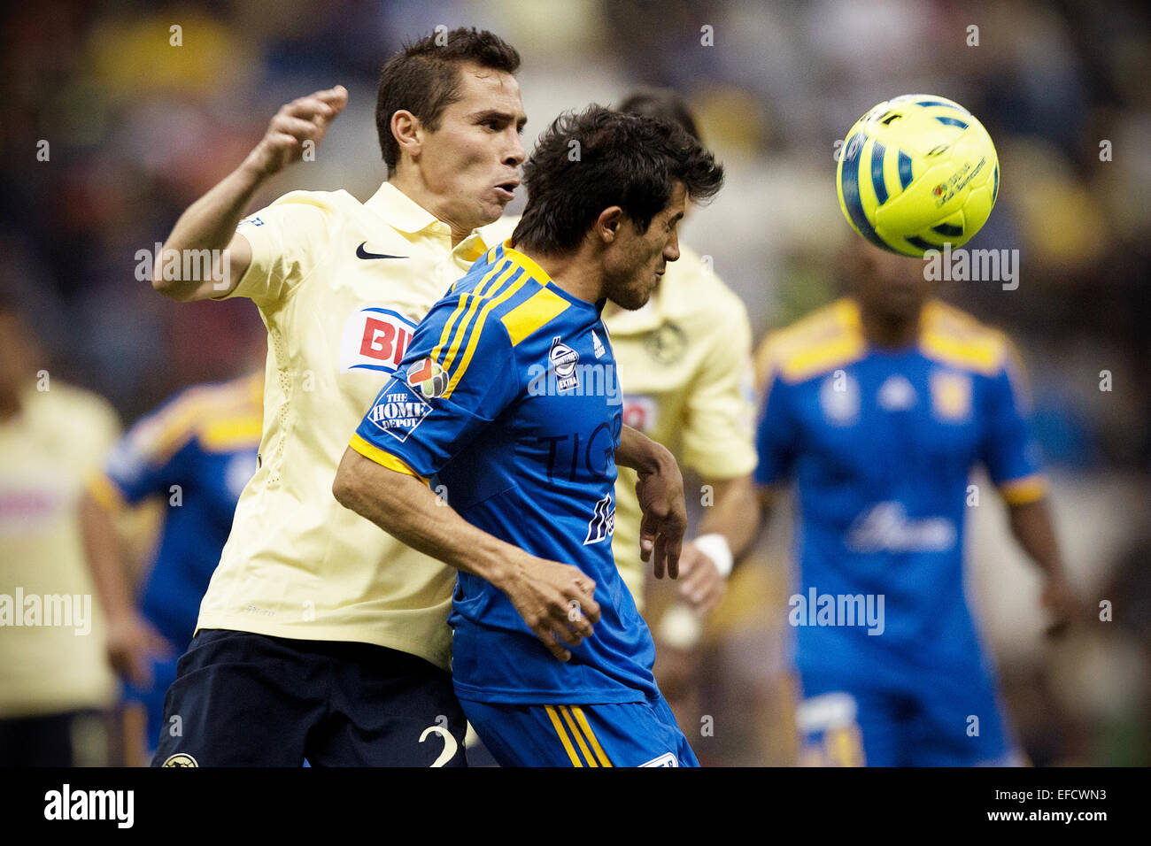 Mexico City, Mexico. 31st Jan, 2015. America's Paul Aguilar (L) vies with Tigres' Damian Alvarez during a match of the Closing Tournament 2015 of MX League in the Azteca Stadium, in Mexico City, capital of Mexico, on Jan. 31, 2015. Credit:  Alejandro Ayala/Xinhua/Alamy Live News Stock Photo