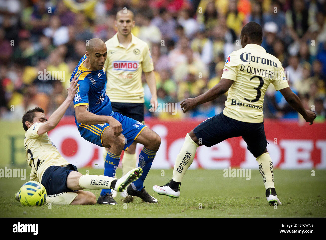 Mexico City, Mexico. 31st Jan, 2015. America's Paul Aguilar (L) and Carlos Quintero (R) vie with Tigres' Guido Pizarro (C) during a match of the Closing Tournament 2015 of MX League in the Azteca Stadium, in Mexico City, capital of Mexico, on Jan. 31, 2015. Credit:  Alejandro Ayala/Xinhua/Alamy Live News Stock Photo