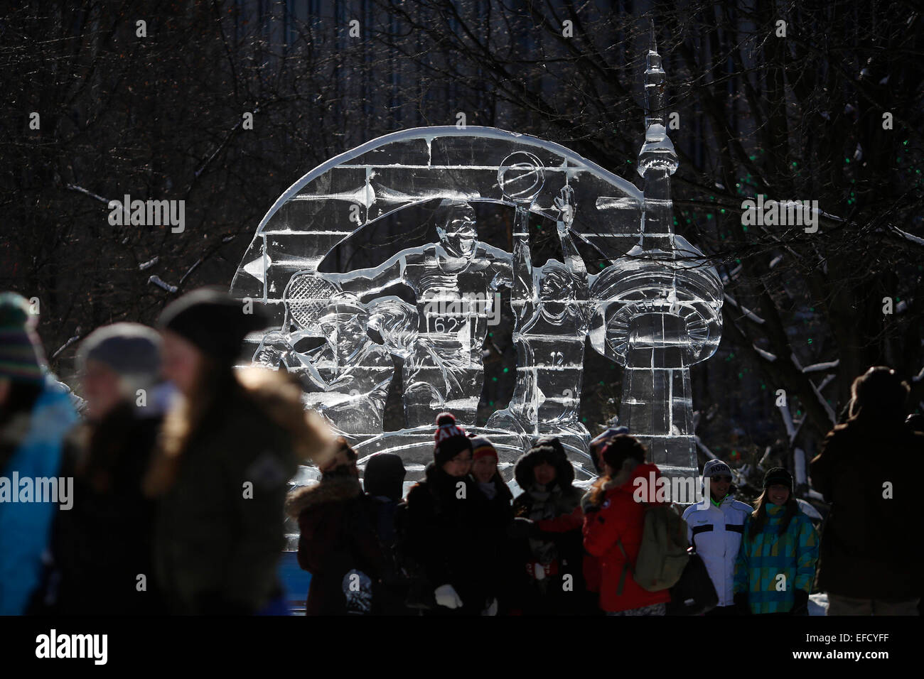 Ottawa, Ottawa. 31st Jan, 2015. An ice sculpture commemorating the upcoming Toronto 2015 Pan Am & Parapan American Games makes a prominent backdrop for visitors to Confederation Park on the opening day of Winterlude, in Ottawa, Canada on Jan. 31, 2015. Winterlude, the National Capital Region's annual celebration of winter, attracts thousands of tourists and locals alike. Credit:  David Kawai/Xinhua/Alamy Live News Stock Photo