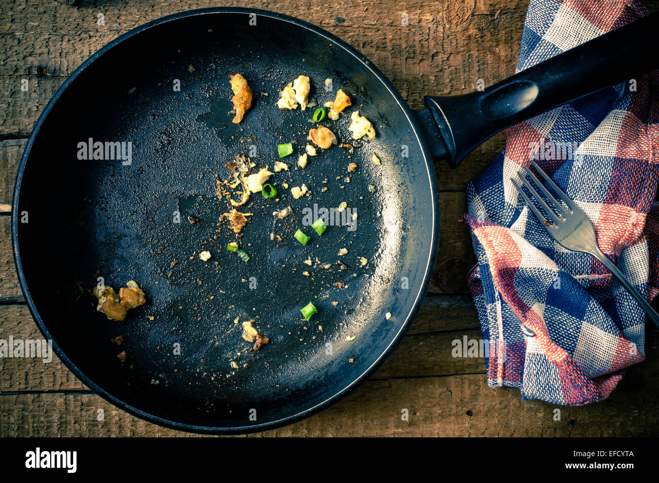 Empty pan with leftovers after dinner village Stock Photo