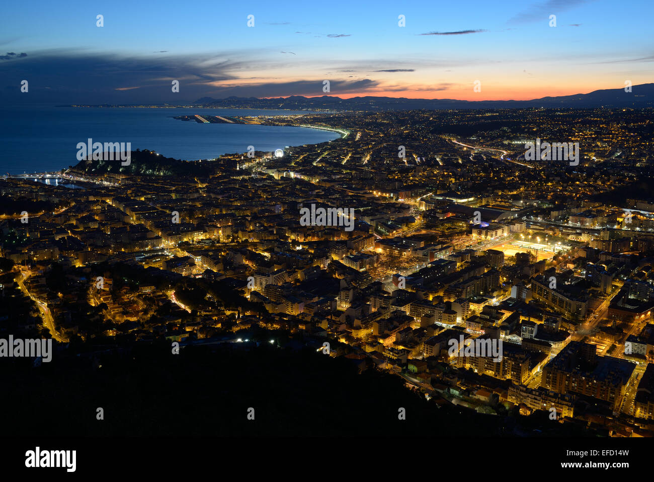 The city of Nice and the famed Bay of Angels at twilight. Alpes-Maritimes, French Riviera, France. Stock Photo